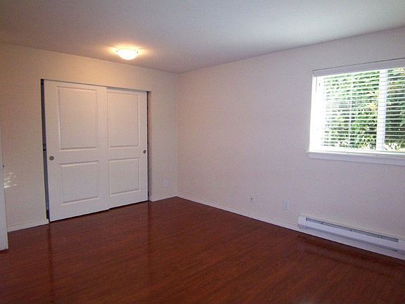 Generous master bedroom; large closet & window for lots of light (wood blinds for privacy).