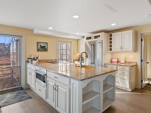 Renovated kitchen with granite countertops and stainless steel appliances