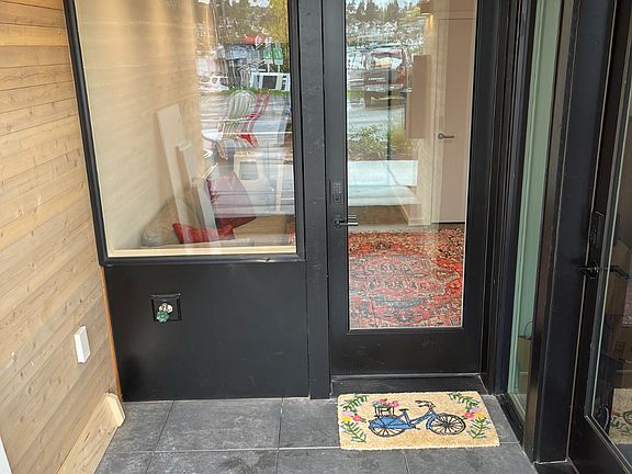 There is a small, shared patio in front of the entrance