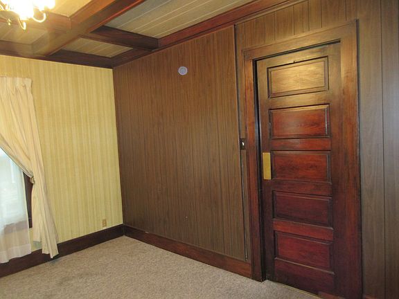 This is the dining room with the door leading to the kitchen.