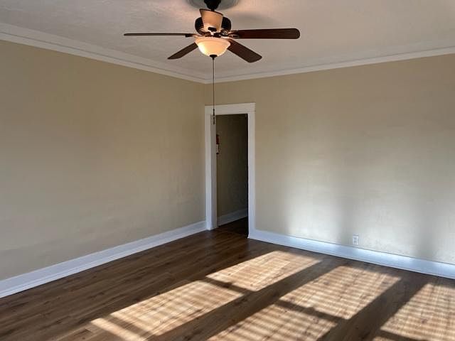 Living room looking to the hallway which leads to the kitchen, bath and bedroom