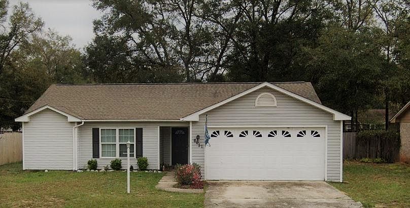 Front View - Large shade trees in rear, privacy fence.