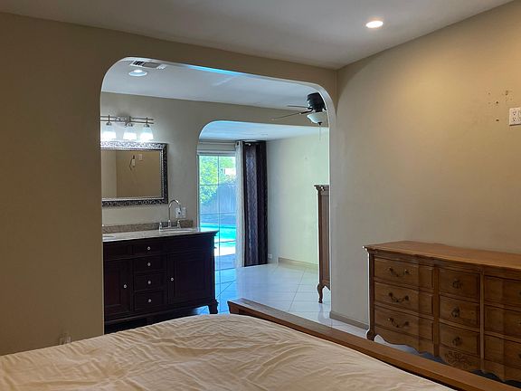 Spacious master Suite has a sunken sitting area and pool access