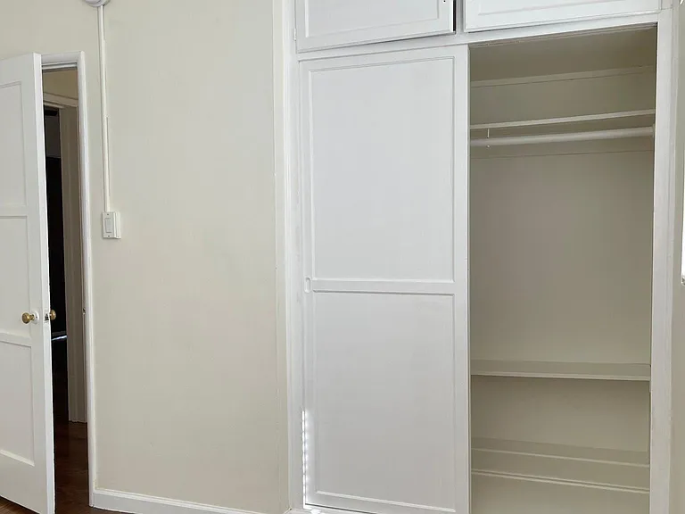 Bedroom closet and above storage