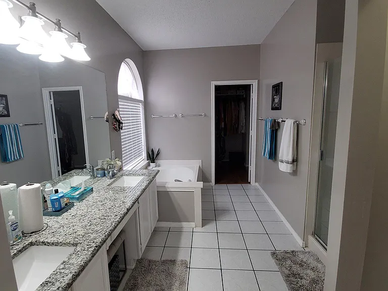 Master bath with 2 sink and walk in closet
