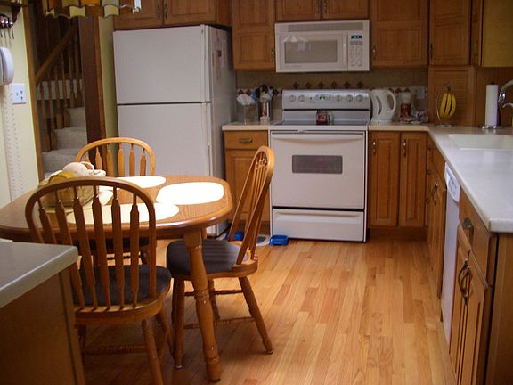 Kitchen showing table and sunlight from skylight
