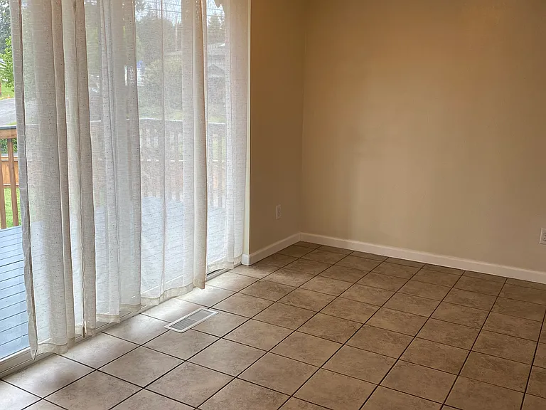 Eat in kitchen with tile floors.