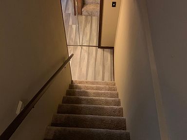 Stairs to basement bathroom