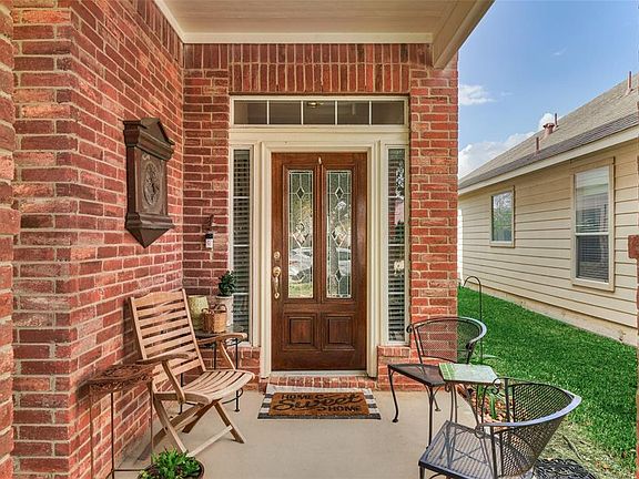 The front door is wood and leaded glass.