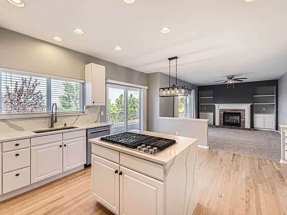 Kitchen island, nook for eating, and family room