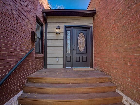 Entry with wood stairs