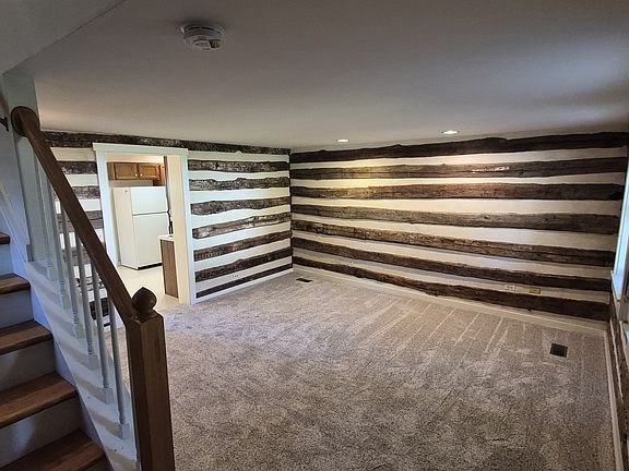 Living room showing log walls