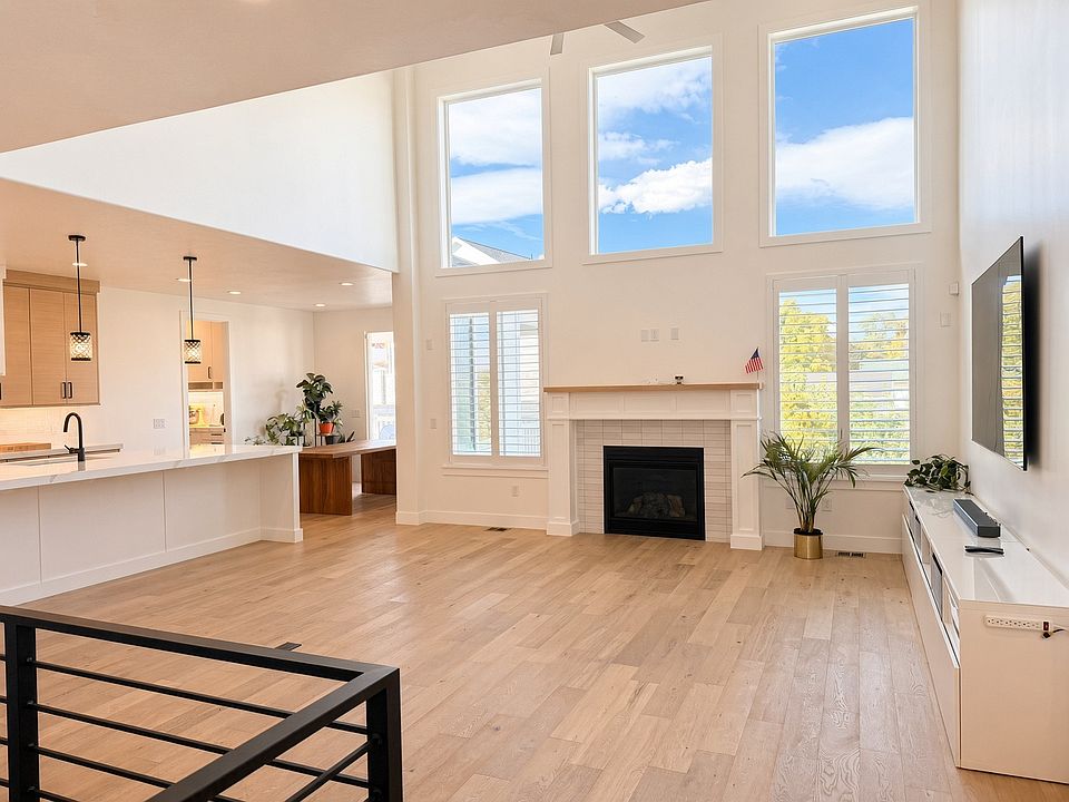 Living Room with Open Ceiling and Windows
