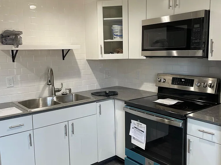 All new kitchen, solid surface counter top. (We are waiting for new tenant before we remove the protective film on appliances.)
