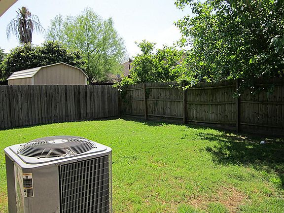 Backyard and A/C unit