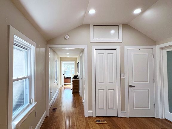 Utility closet and attic space provides you with room to tuck away items that you don't want in the open, and behind the door on the right is a stacked washer and dryer