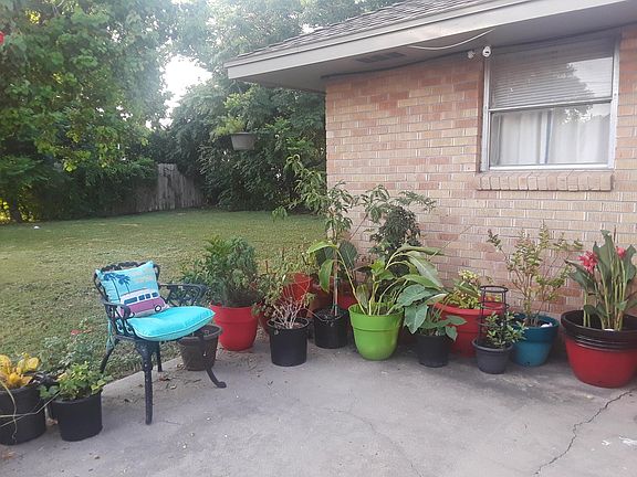 The large backyard has early morning and evening shade.