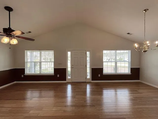 Living room and dining area view from the hallway.