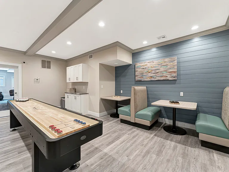 Resident lounge with billiards, foosball, shuffleboard, flatscreen TV, and free WiFi!