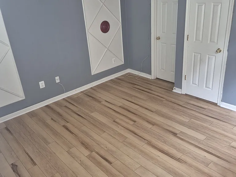 Finished basement or home office or recreation room or fitness space or guest suite