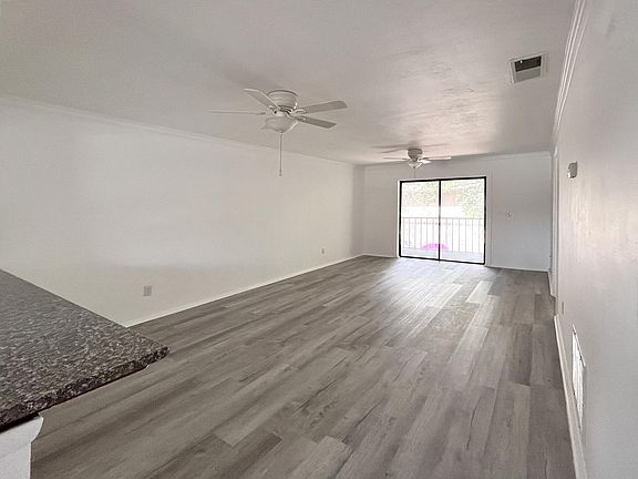 Open floorplan living space to live/dine/work. Brand new laminate wood flooring.