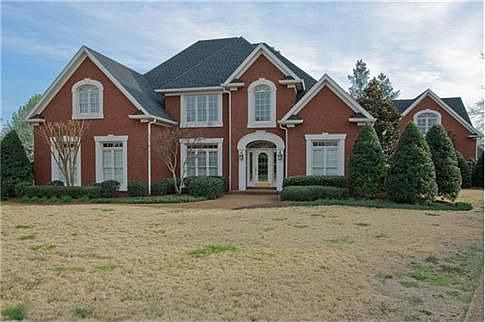 There is over 5,000 sq.ft. of living space in this stately all brick home and all brick guest house 