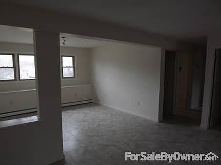 family room
						:
						new tile floors, with new 6' sliders walk out basement