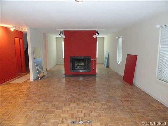 UNIQUE LIVING AREA ATTACHED TO KITCHEN WITH FIREPLACE AND FANTASTIC NATURAL LIGHT