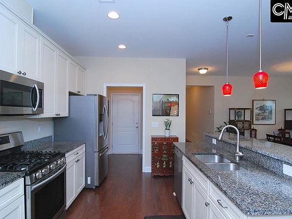 Kitchen showing door from garage into mud room, laundry room