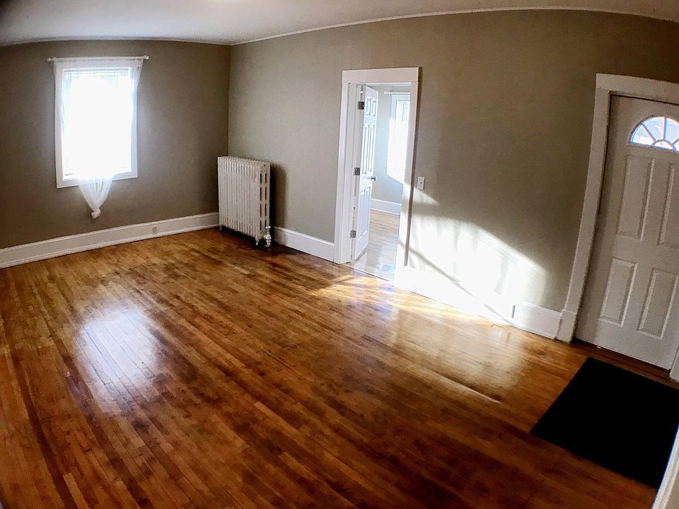 Large, sunny living room with beautiful hardwood floors