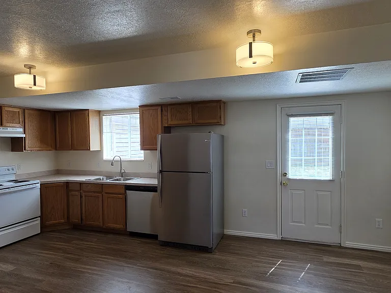 KITCHEN, DINING AREA, & DOOR TO BACK YARD
