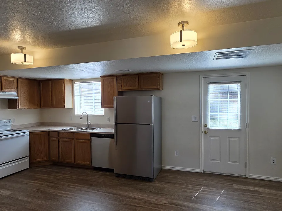 KITCHEN, DINING AREA, & DOOR TO BACK YARD