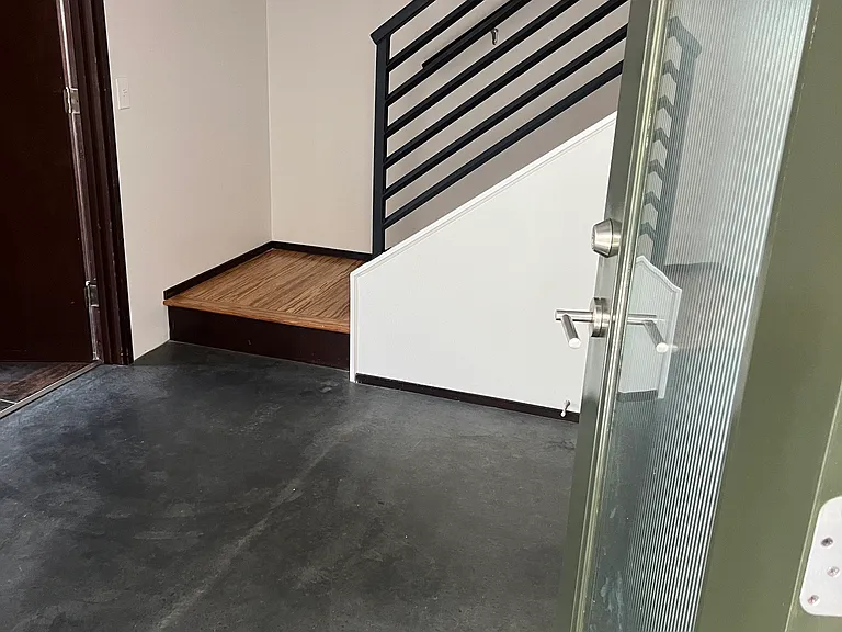 Polished concrete at entry from outside and garage.
