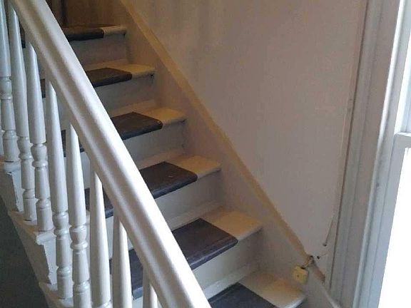 Stairs inside secure entryway.