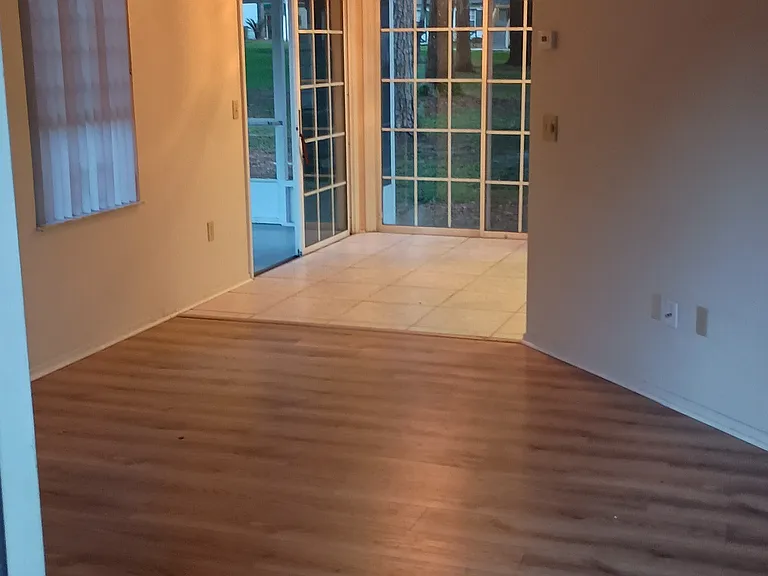 View of living room leading into dining room taken from the front door.