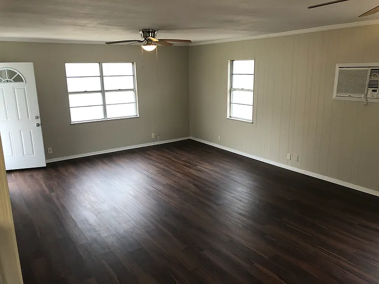 Large living room with new luxury vinyl plank flooring.