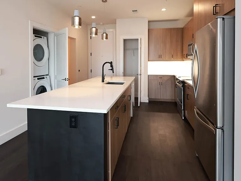 Kitchen with Stainless Steel Appliances and In-home Washer and Dryer