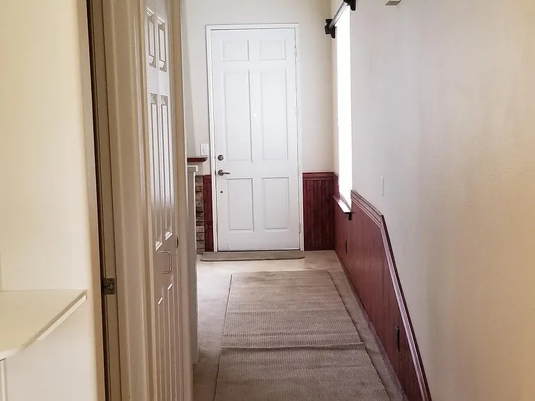 View of downstairs hallway towards entry