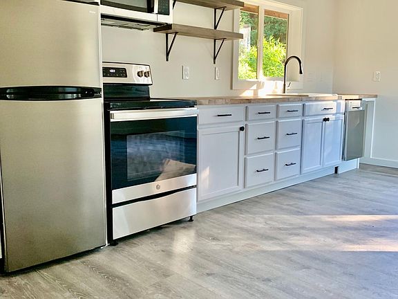 Newly completed kitchen complete with new appliances including dishwasher and tons of storage