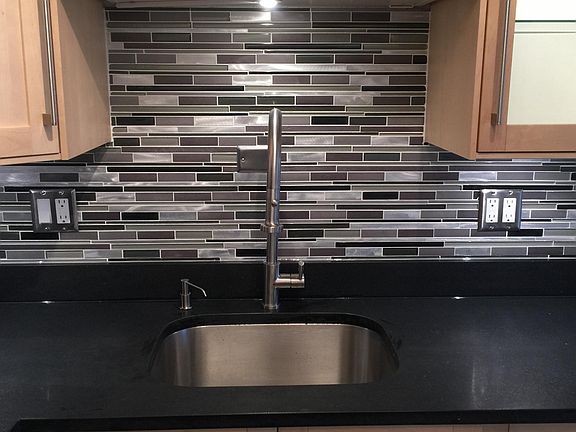 Kitchen sink with tile backsplash