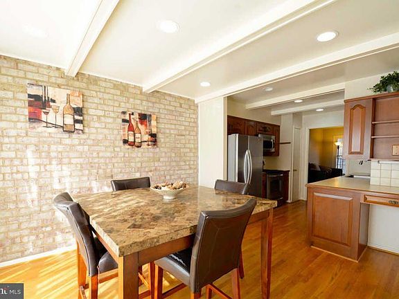Eat in kitchen with exposed brick
