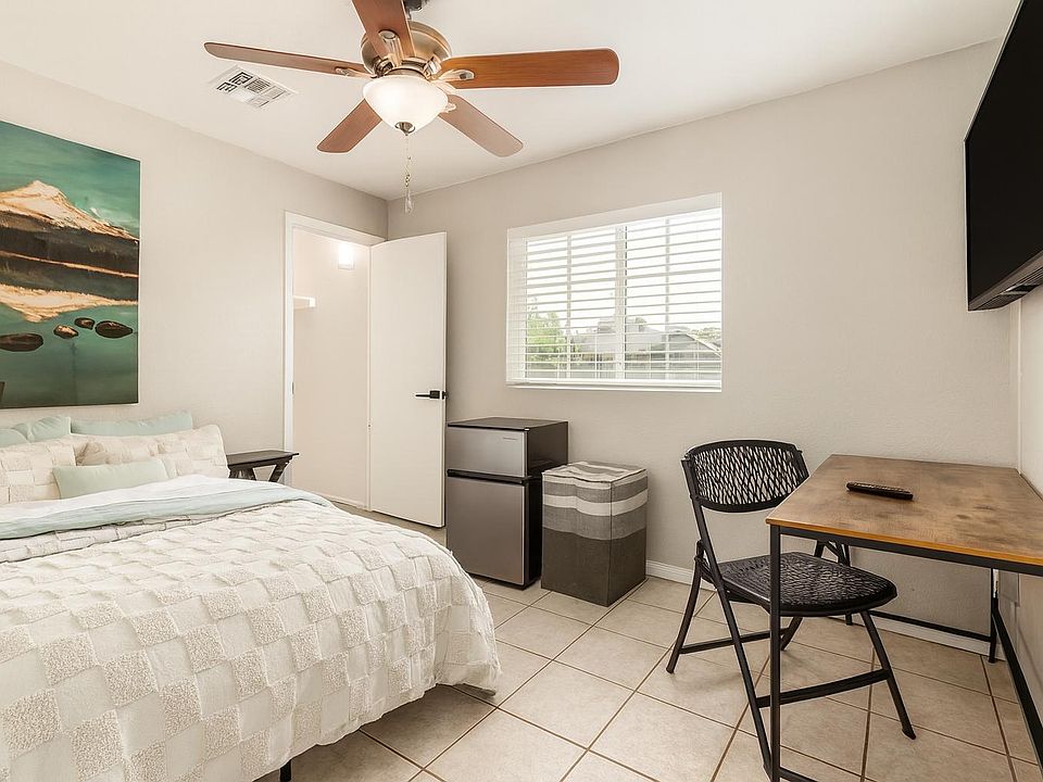 Bedroom 2- Features a Walk-In Closet, Designated Workspace, Mini Fridge and Mounted TV!