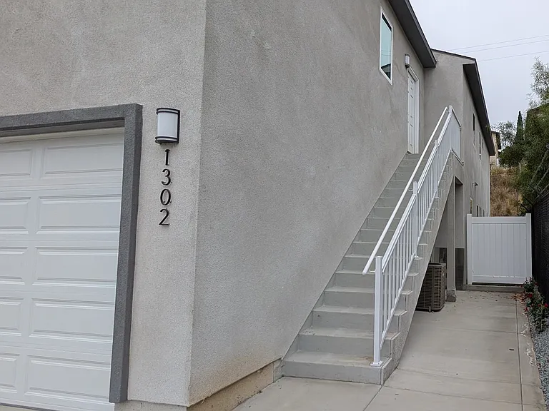 Entrance to unit, parking for unit is on the street. The garage is for the primary home.