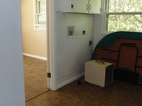 Laundry room and entry to bedroom #2