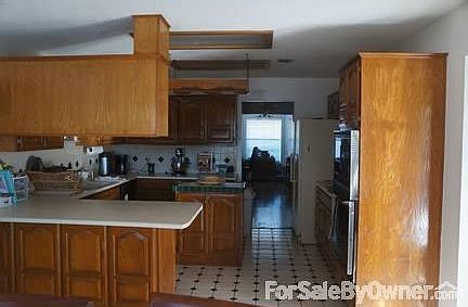 Kitchen
						:
						View from the breakfast nook through the kitchen, dining and into the office.