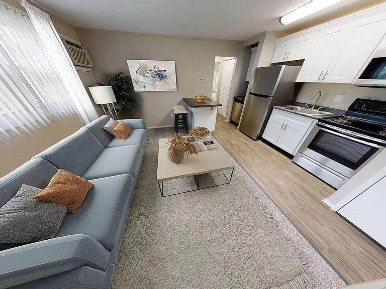 Enjoy seamless living with an open-concept layout that combines a cozy living space and modern kitchen.