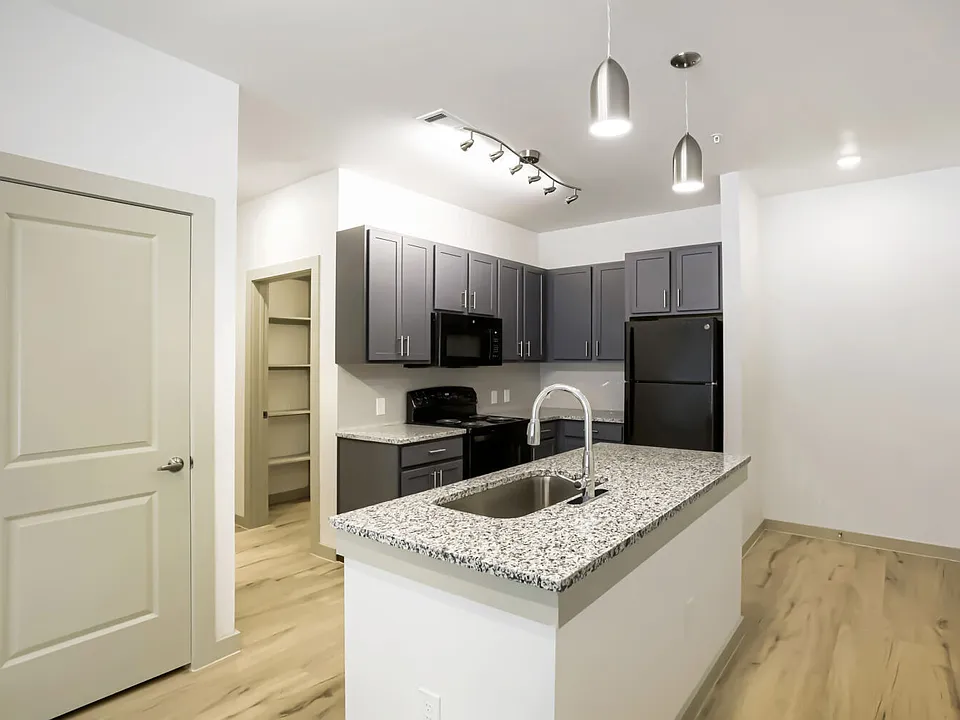 kitchen with view of front door and closet