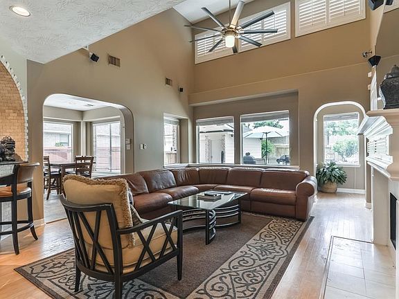 The grand family room provides ample natural light, easy access to the adjacent kitchen and backyard oasis.  The family room is well appointed with a gas fireplace, plantation shutters and new interior paint.  Surround sound provided throughout the home.