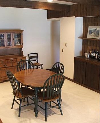 The spacious dining room features a built-in buffet and cabinets.