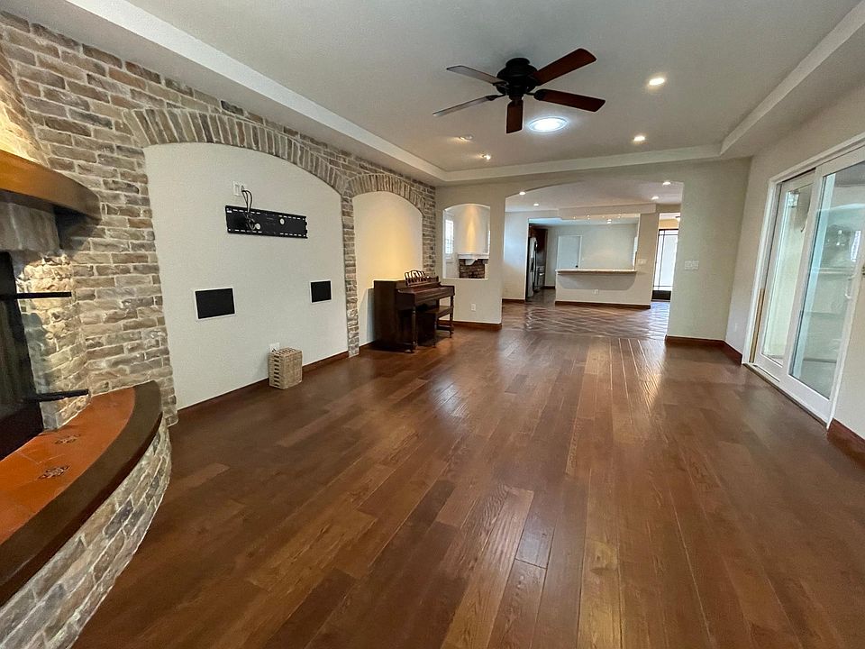 Spacious living room with fireplace and stone feature with space for large flatscreen